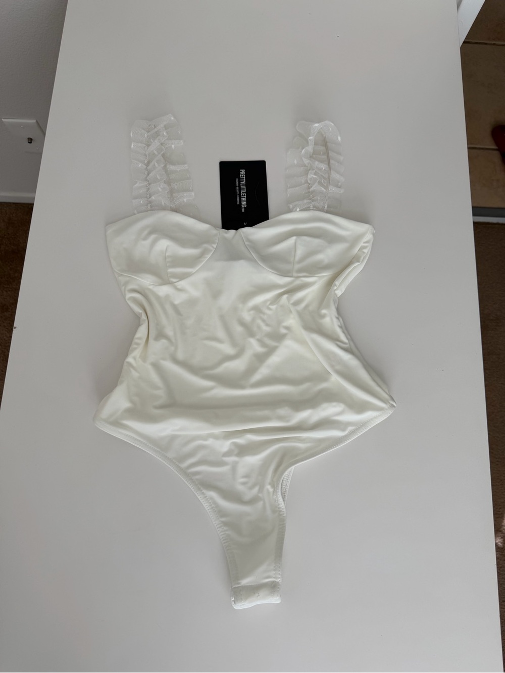 PrettyLittleThing White Structured Cup One-Piece Bodysuit with Ribbon Straps